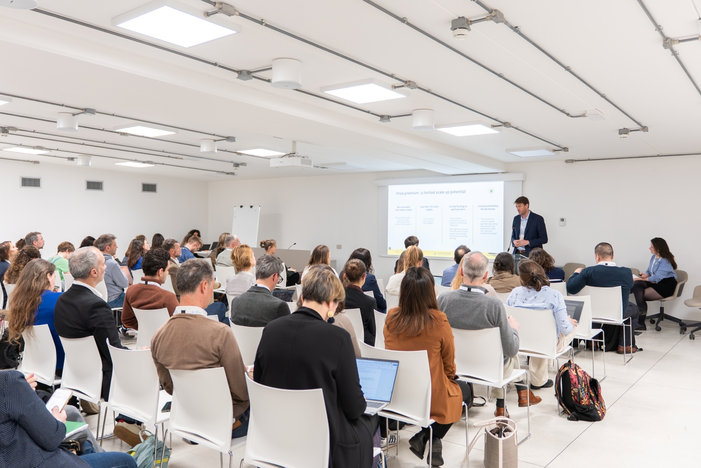 Researcher presenting findings to an audience.